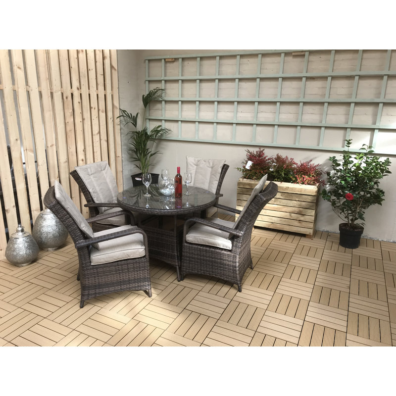 Bernelle 4 - Person Wicker Patio Dining Set with Round Table , Cushions Included
