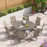 Nectarie Round 8 - Person 54'' L Outdoor Patio Dining Set with 8 Swivel PVC-Coated Polyester Chairs