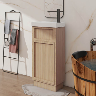 Meuble-lavabo compact de 15,75 po avec une armoire réversible en résine, une tablette réglable et une porte à pousser