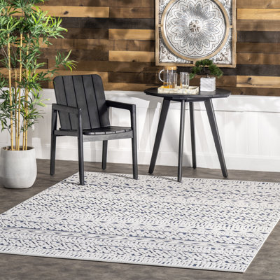 Tapis bleu Ikponmwosa