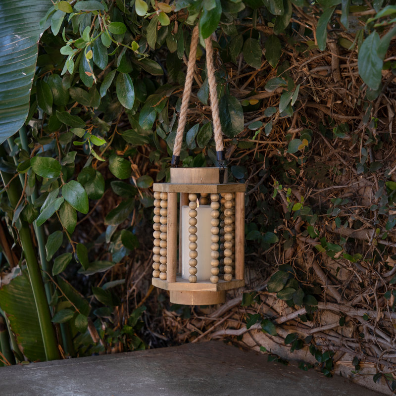 Wood Hurricane Lantern with Spindled Ball Columns and Rope Handle in Casual Home Style Decorative Accent Lighting for Rustic Coastal Farmhouse or Boho Inspired Interiors.