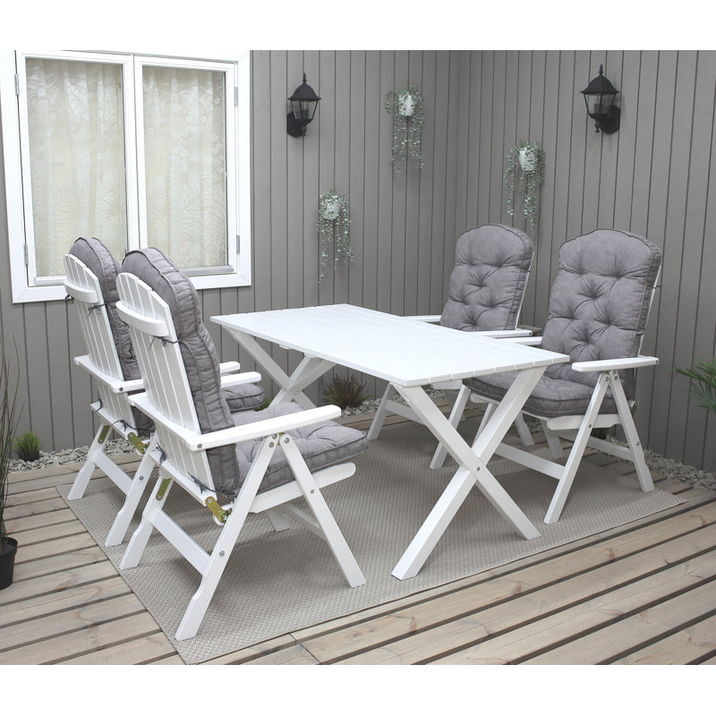 Capuano 4 - Person Wood Patio Dining Set with Rectangular Table , Cushions Included