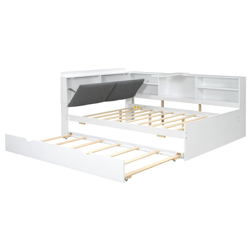 Lit plateforme en bois avec lit gigogne, tablettes et tête de lit en bois