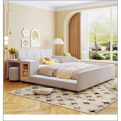 Lit tapissier au sol avec bureau de chevet et petit tabouret rond, parfait pour les chambres d'enfants et les petits espaces