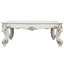 Table basse antique avec pieds décoratifs à volutes - s'adapte à divers environnements