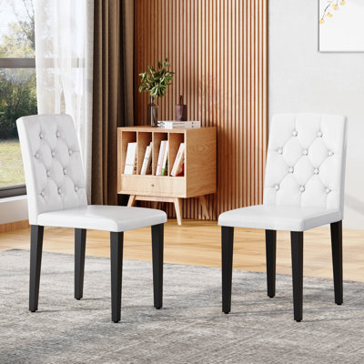 2-Pack White PU Leather Dining Chairs With Ergonomic Buckle Backrest And Black Metal Legs For Dining Room And Banquet Hall