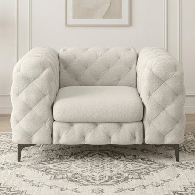 Fauteuil Chesterfield capitonné et rembourré en polyester