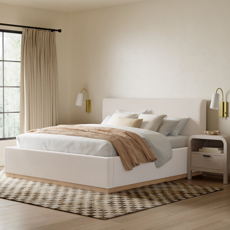 Delpha Grounded Upholstered Wood Base Bed