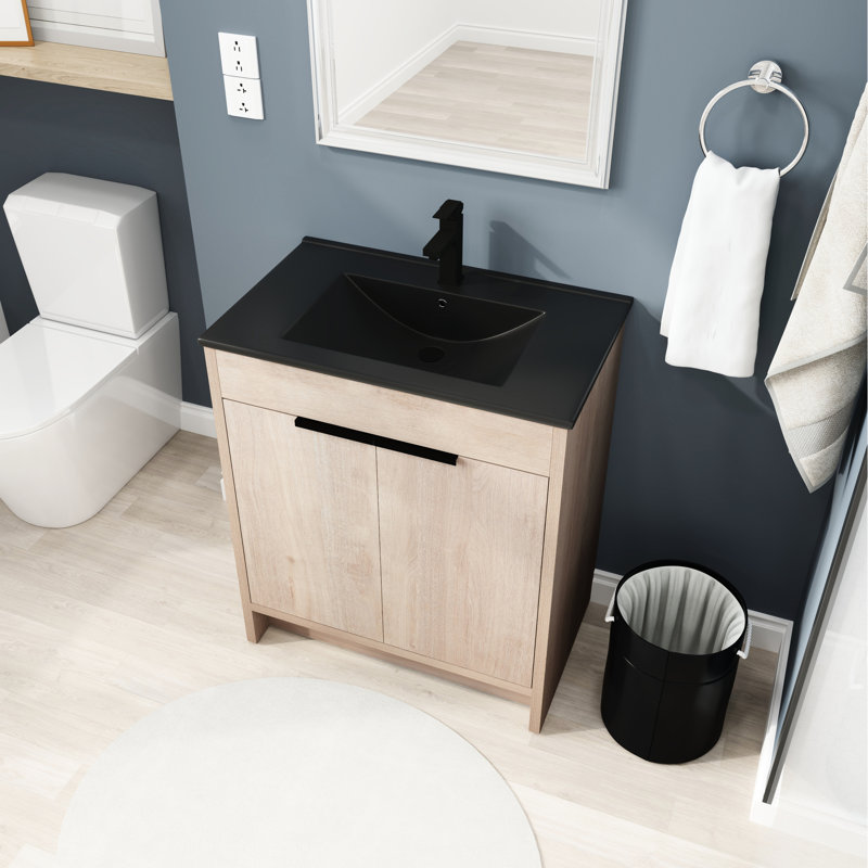 Meuble-lavabo de 30 po autoportant avec comptoir en céramique noire. 2 portes d'armoire à fermeture en douceur. Contreplaqué moderne. Lavabo à tablette réglable et fabrication en contreplaqué.