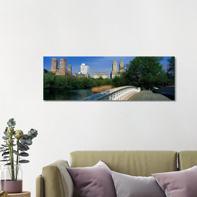 View Of Historic Buildings Along Central PArk West From Bow Bridge - Wrapped Canvas Panoramic Print