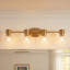 Éclairage pour salle de bain 3 lumières en laiton brossé avec abat-jour en verre transparent Jessa-1684681961-1684681957
