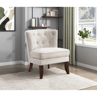 Chaise d'appoint moderne capitonnée à boutons avec pieds en bois massif, parfaite pour les salons classiques et contemporains.