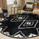 Latitude Run® Vefsna Nikolis Rug Black
