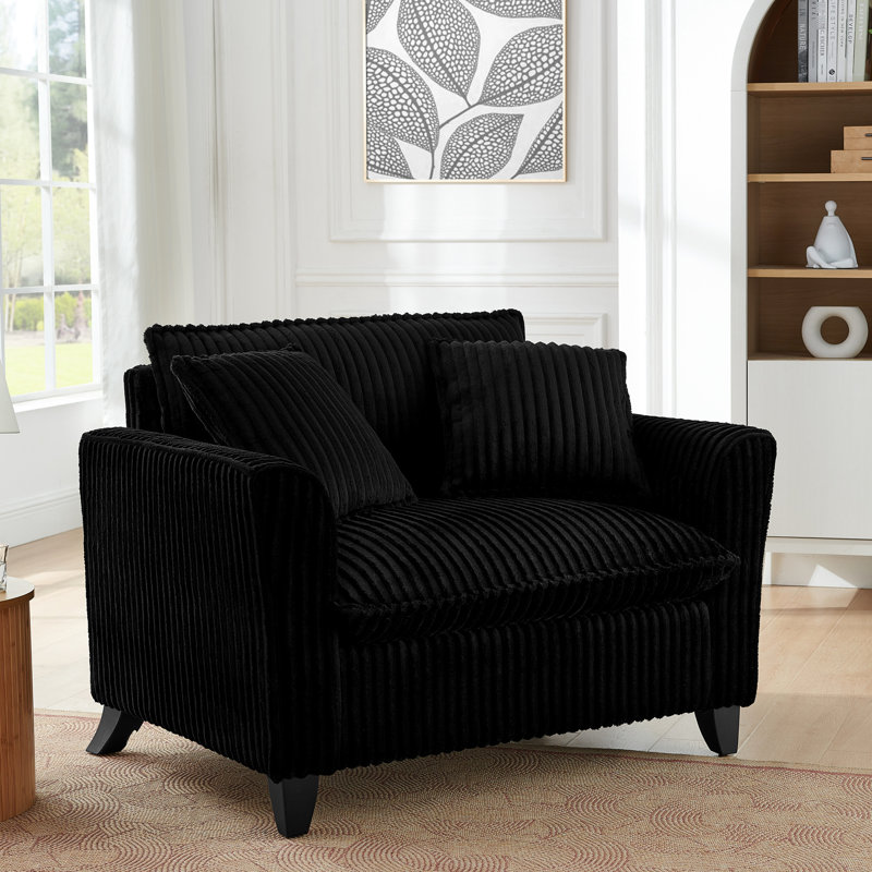 Chaise noire avec coussin de siège moelleux, adaptabilité à l'espace et plaisir de bricolage dans l'espace de la maison,