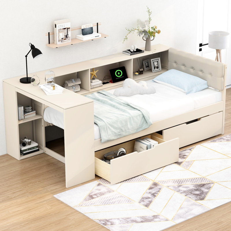 Lit simple en bois avec tête de lit tapissier crème, tablettes de rangement, tiroirs et station de charge