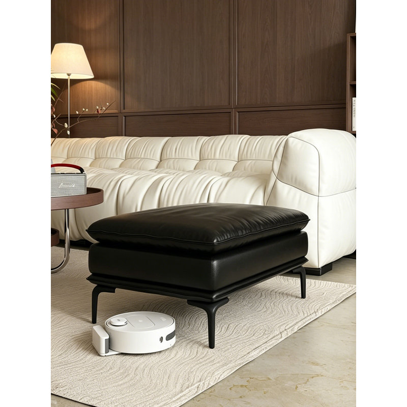 Repose-pieds en cuir noir avec repose-pieds
