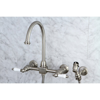 Kingston Brass Restoration Double-Handle 3-Hole Wall-Mount Bridge Kitchen Faucet with Brass Sprayer