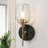 Adelgunde Modern Blcak Brass Wall Sconce Bathroom Vanity Light With Clear Water Glass