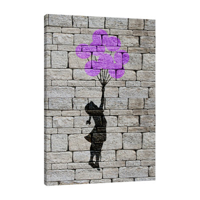 «Flying Balloon Girl On Brick Wall», toile tendue par Banksy