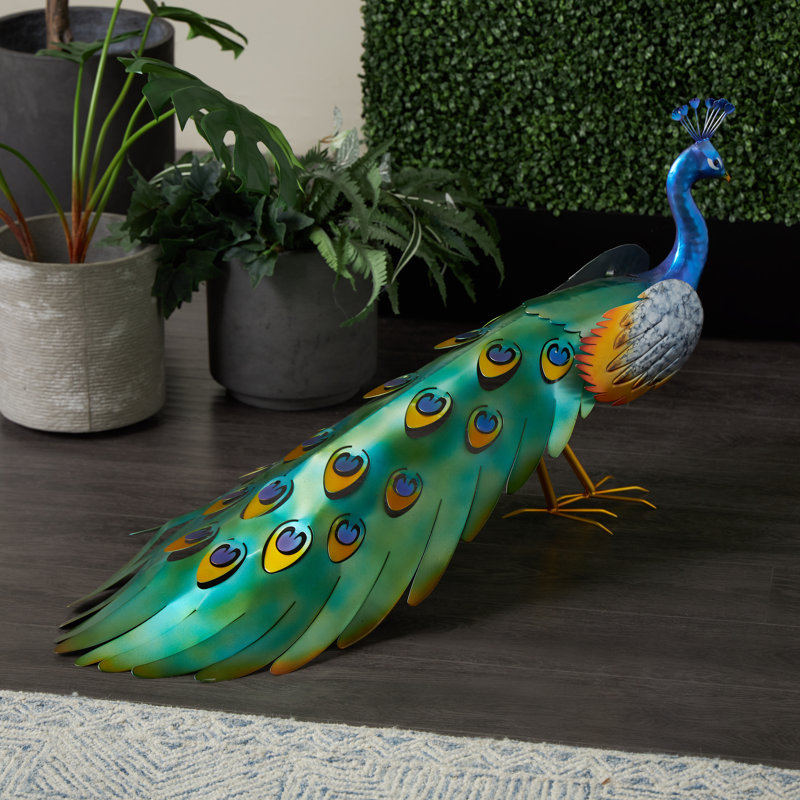 Cole And Grey Metal Peacock Blue Decorative Garden Sculpture With Gold Legs And Teal Wings
