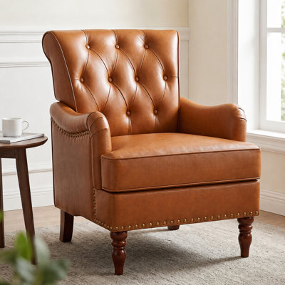 Fauteuil à oreilles 29 po capitonné avec garniture cloutée et pieds en bois tournés rétro