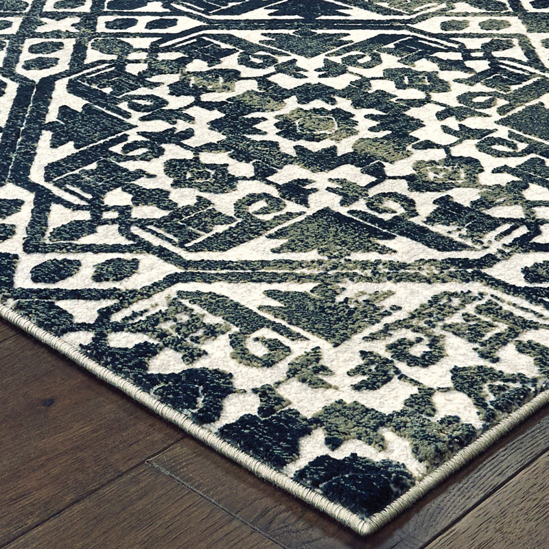 Tapis bleu marine / ivoire en polypropylène tissé à la machine Leonel, Rectangle 6 pi 7 po x 9 pi 6 po