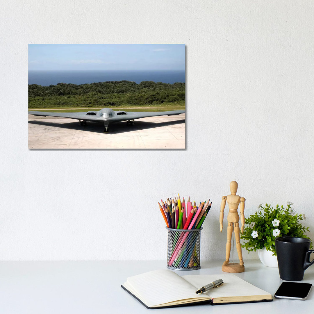 A B-2 Spirit Stealth Bomber Waits On The Flightline - Wrapped Canvas Print