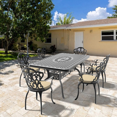7-Piece Set Of Cast Aluminum Patio Furniture With Black Frame And Off-White Seat Cushions