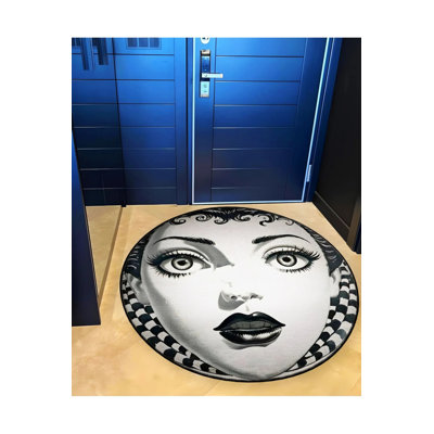 Black And Beige Vintage Woven Carpet With A Woman's Face Pattern