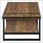 Table basse de style industriel-campagnard rectangulaire avec aspect bois récupéré et pieds en métal, parfaite pour les salons modernes