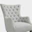 Fauteuil à oreilles capitonné