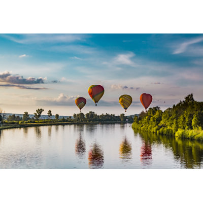 Balloons Near River by Andrey Danilov - Wrapped Canvas Print