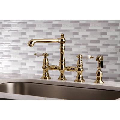 Kingston Brass English Country Two-Handle 4-Hole Deck Mount Bridge Kitchen Faucet with Brass Side Sprayer