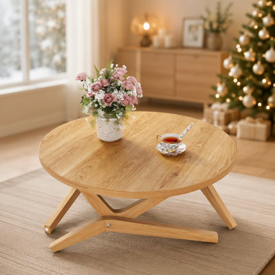 Table basse ronde en bois massif avec mécanisme de hauteur réglable pour une utilisation polyvalente