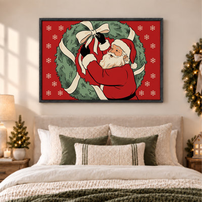 «Santa Claus Tiant Ribbon On Green Wreath on Red Christmas», art mural sur toile