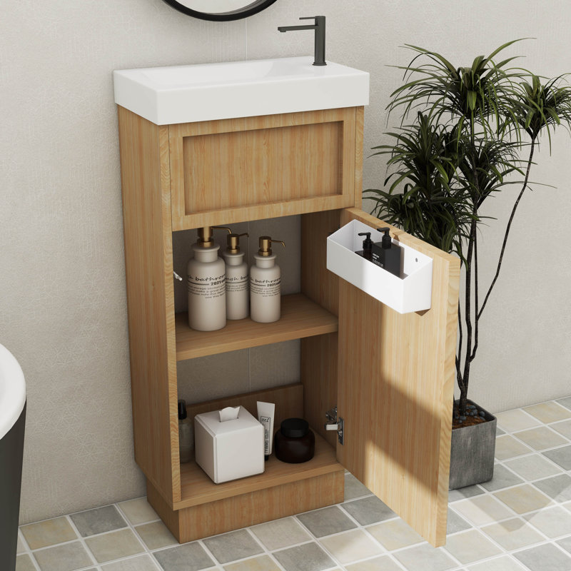 Meuble-lavabo compact de 15,75 pouces avec une armoire réversible en résine, une tablette réglable et une porte à ouverture par pression