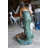 Metal Girl Holding a Pot on Shell Fountain