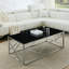 Table basse élégante et moderne avec plateau en verre trempé et structure en acier inoxydable, parfaite pour le salon et la chambre à coucher