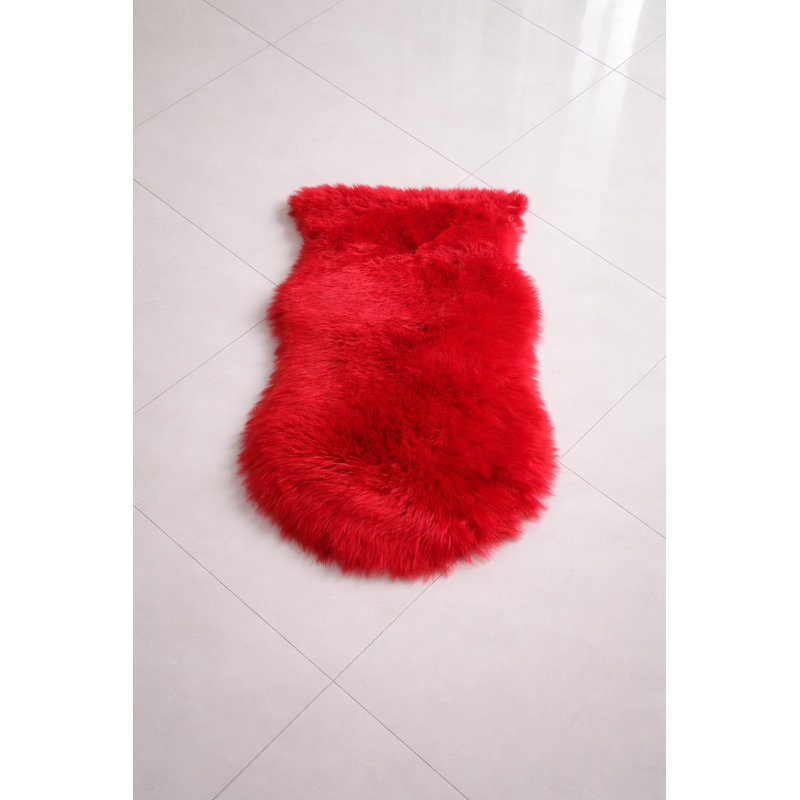 Oval Solid Colour Sheepskin 60cm X 110cm Area Rug, Red