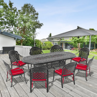 Ensemble de salle à manger de table ovale en fonte d'aluminium avec trou pour parasol et coussins de couleur rouge L 86,22 po L 42,32 po Anadolu
