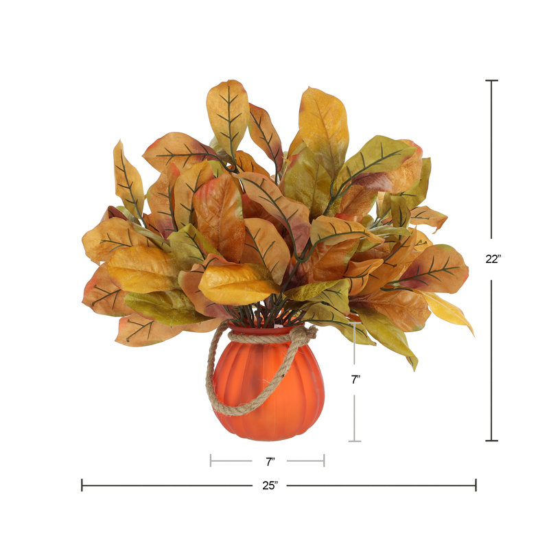 Fall Leaves Arranged in Glass Pumpkin Vase
