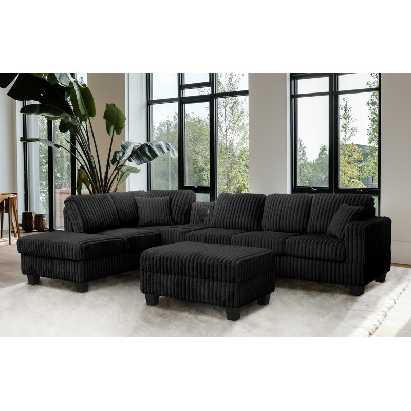 Vega Reversible Faux Fur Sectional with Media Console And Storage Ottoman, Black Carduroy