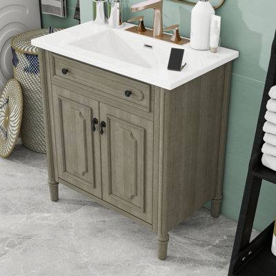 Meuble-lavabo autoportant élégant avec lavabo en céramique brillante, portes à fermeture douce et tablette réglable
