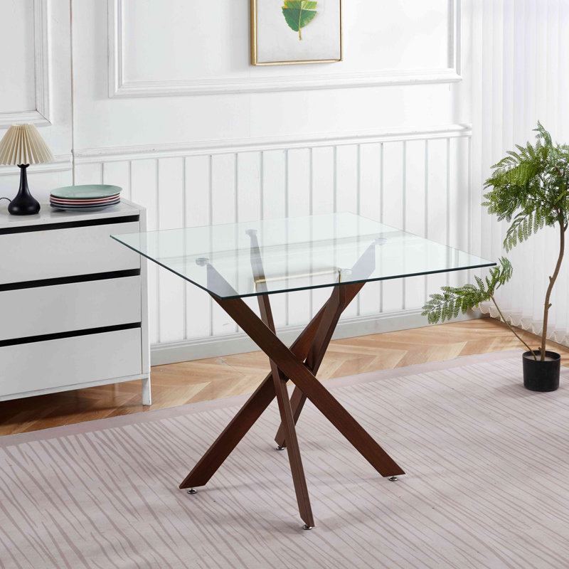 Table de salle à manger à pieds croisés, Plateau transparent / base noyer