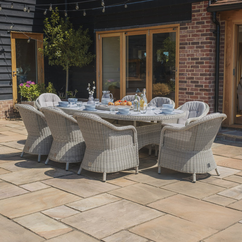Anissah 8 - Person Patio Dining Set with Oval Table