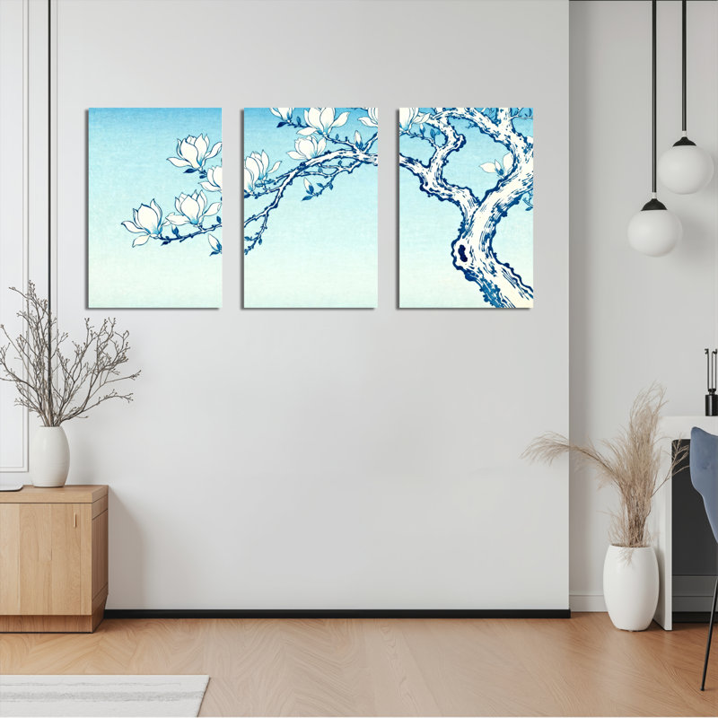 Ensemble de 3 tableaux sur toile tendue représentant un magnolia bleu et blanc, H 30 po x l 60 po