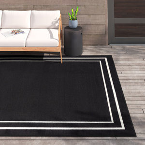 Aubreanna Abstract Machine Woven Chenille Area Rug in Black