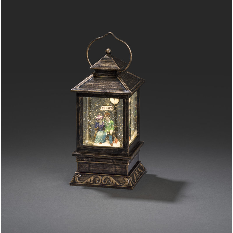Snow Lantern with Seated Couple on a Bench