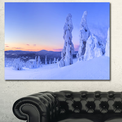« coucher de soleil par-dessus les arbres congelés », reproduction de photo sur toile tendue