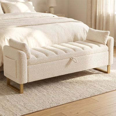Banc de rangement capitonné de 170 cm avec coussin en tissu couleur crème et pieds en métal doré